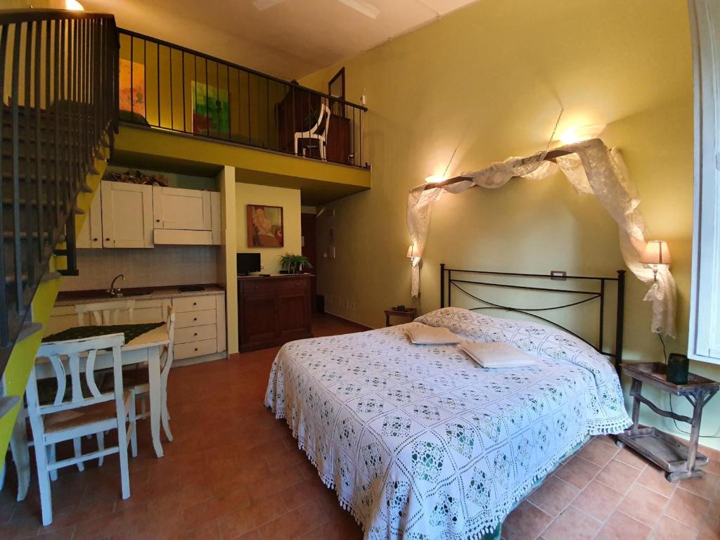 Łóżko lub łóżka w pokoju w obiekcie Bio Agriturismo Valle dei Calanchi