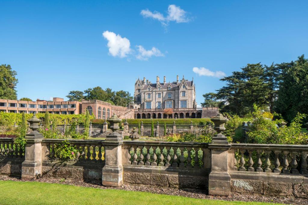 a fence in front of a large house at Lilleshall House and Gardens in Telford