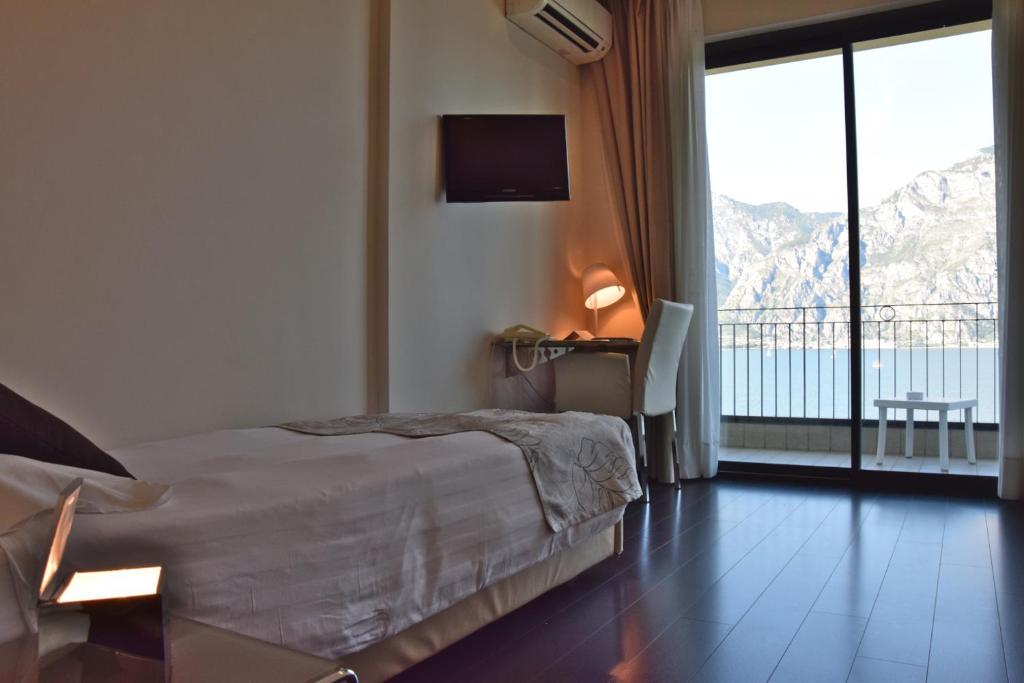 Postel nebo postele na pokoji v ubytování Piccolo Hotel