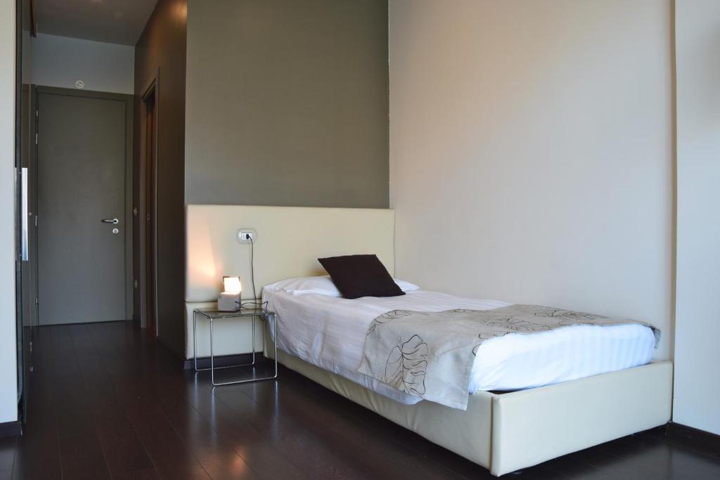 Postel nebo postele na pokoji v ubytování Piccolo Hotel