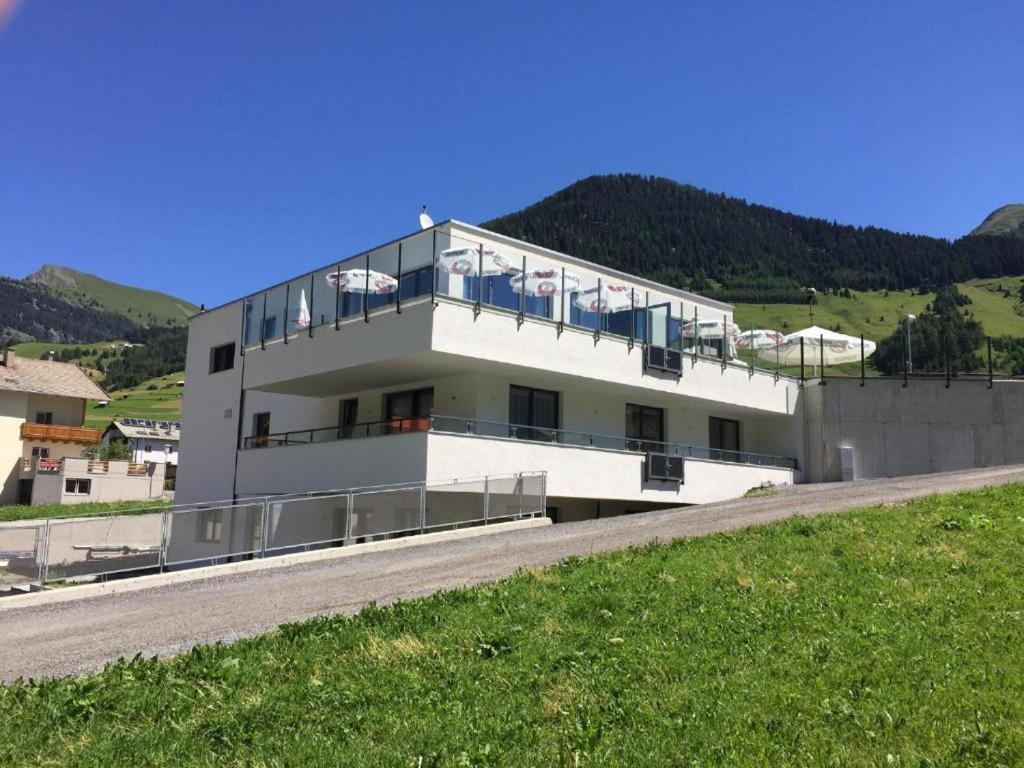 a large white building on the side of a road at Ibex Hostel in Nauders