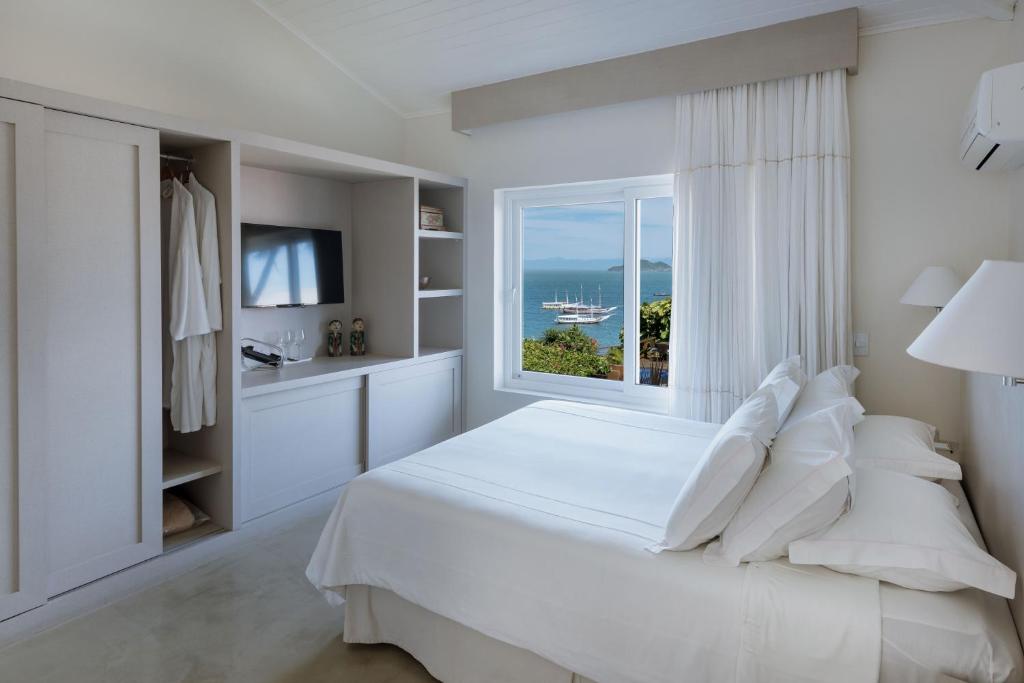 Postel nebo postele na pokoji v ubytování Abracadabra Boutique Hotel