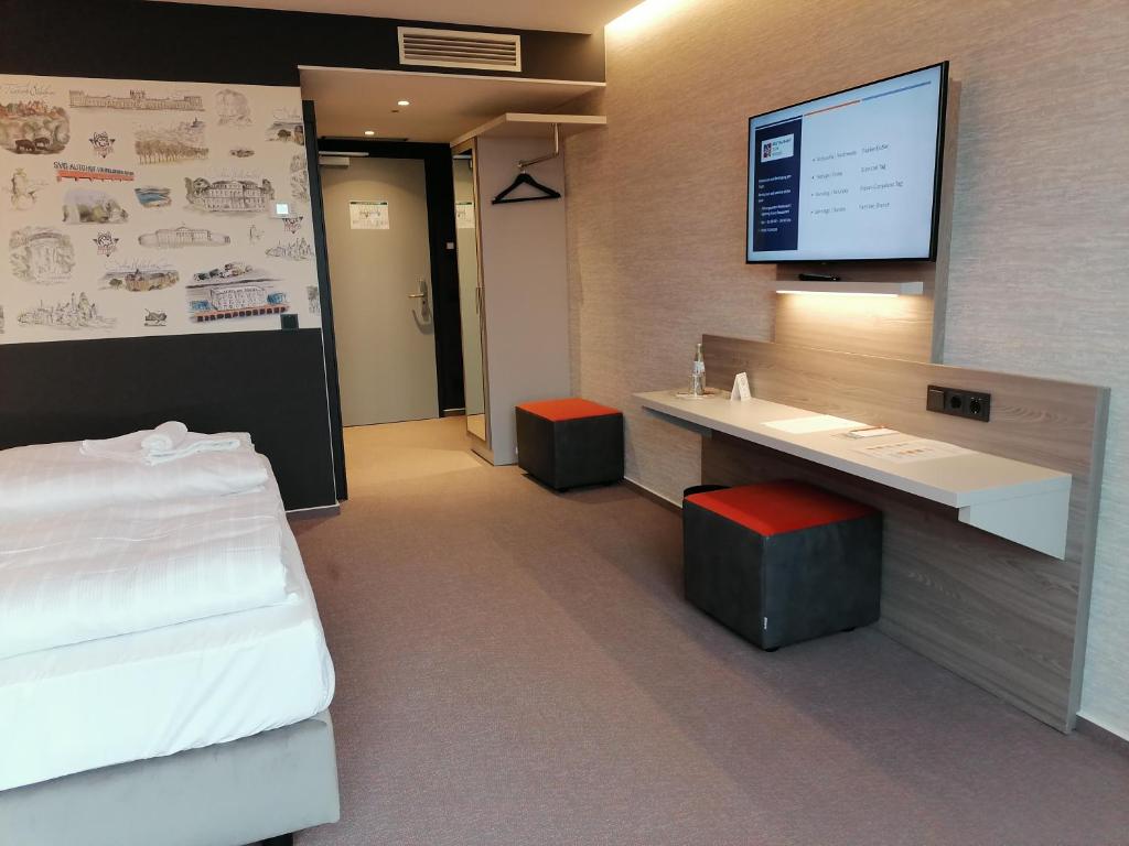 Postel nebo postele na pokoji v ubytování Hotel am Rüssel