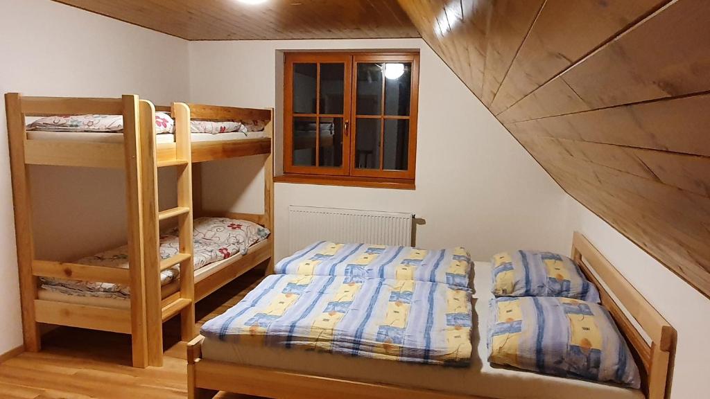 Postel nebo postele na pokoji v ubytování Apartmány Orlice