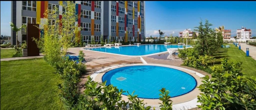 a large swimming pool in front of a building at PLT Lego Holiday Village Antalya in Antalya