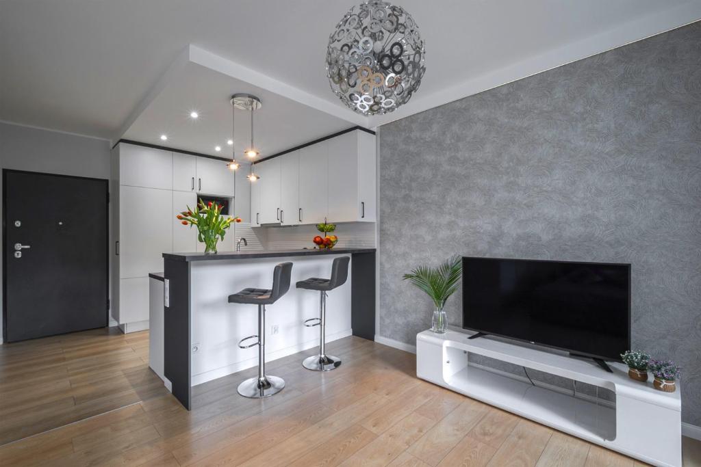 TV a/nebo společenská místnost v ubytování Dream4You Apartments