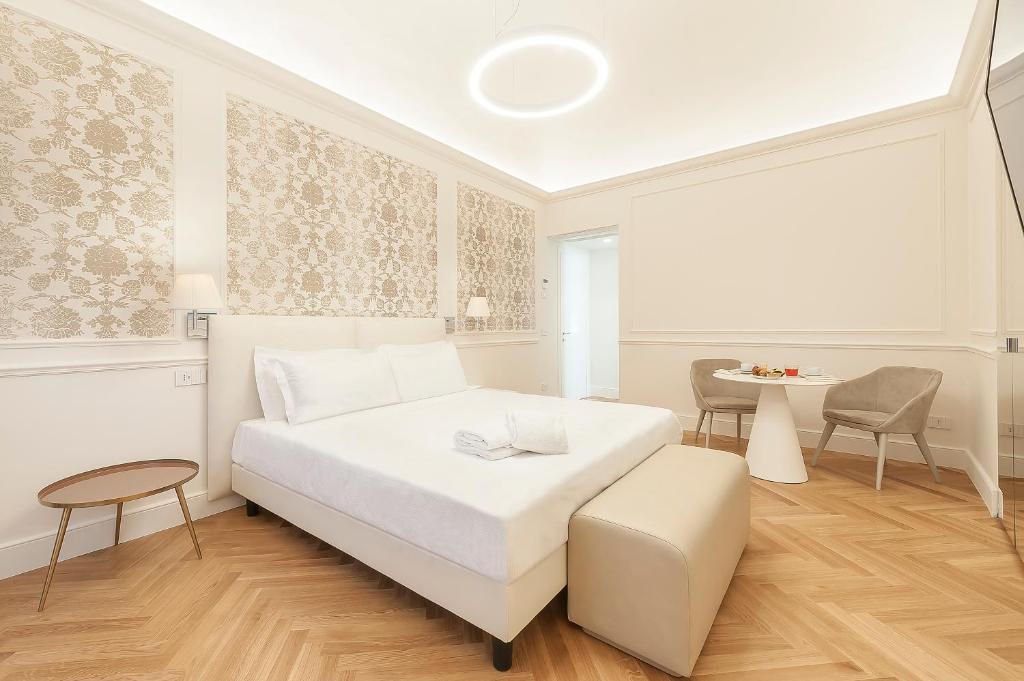 Łóżko lub łóżka w pokoju w obiekcie Asisium Boutique Hotel