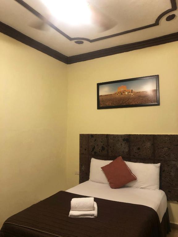 Postel nebo postele na pokoji v ubytování Hotel Rinconada del Convento