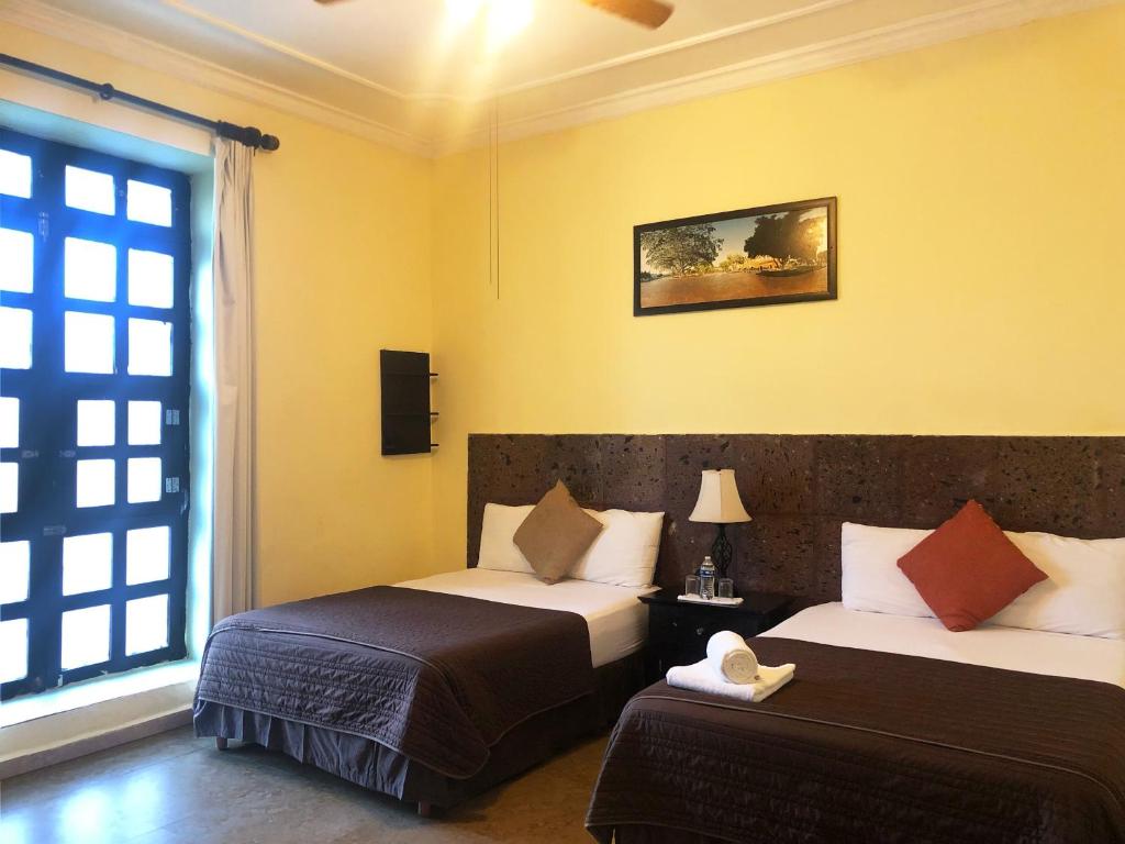 Postel nebo postele na pokoji v ubytování Hotel Rinconada del Convento