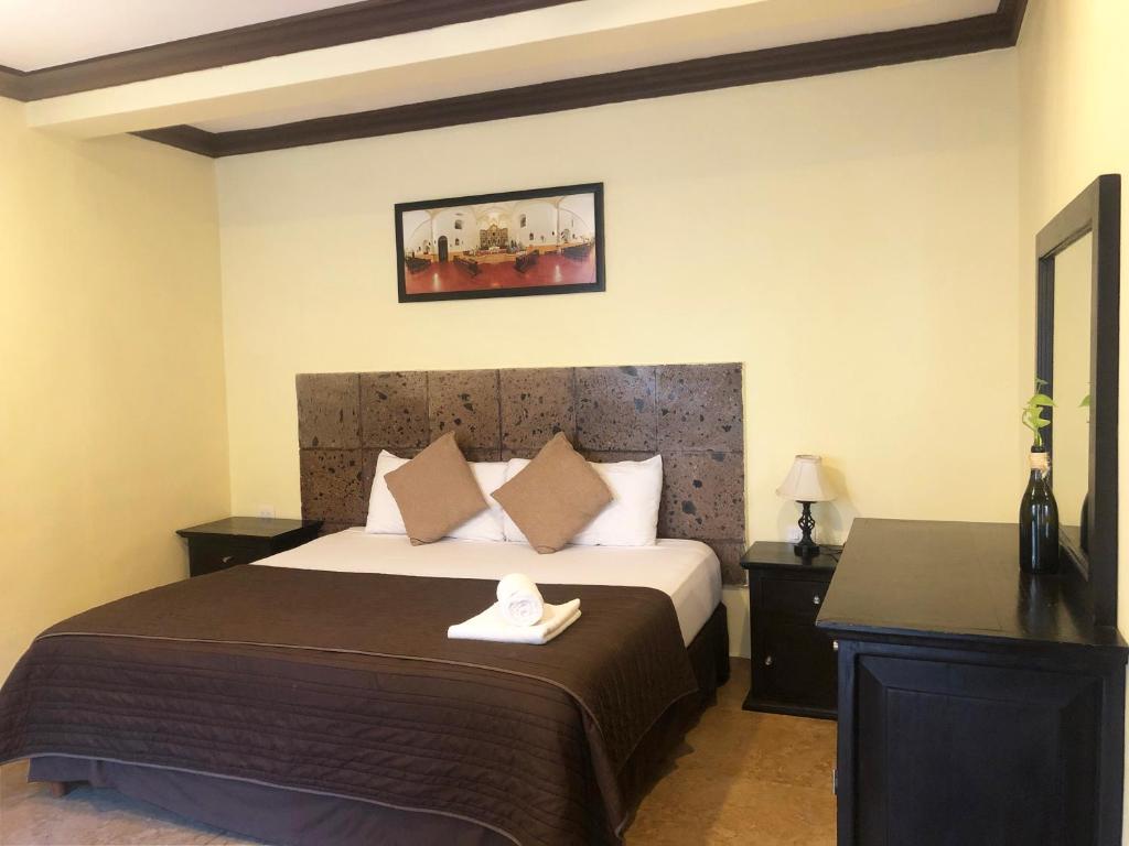 Postel nebo postele na pokoji v ubytování Hotel Rinconada del Convento