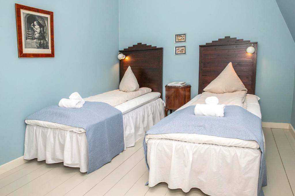 Postel nebo postele na pokoji v ubytování Fuglsang Herregaard Hotel