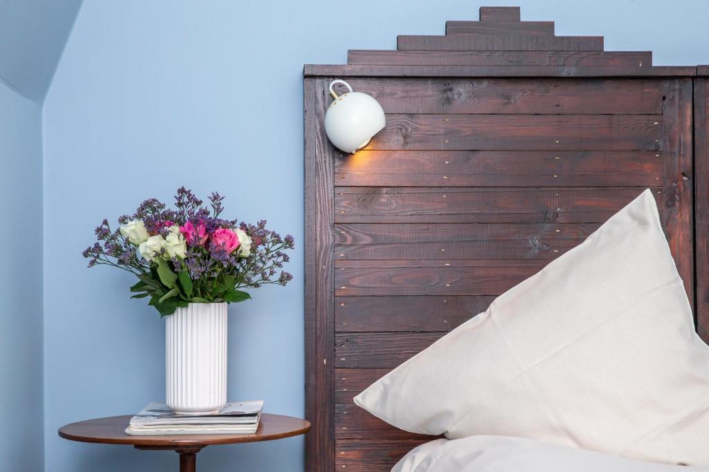 Postel nebo postele na pokoji v ubytování Fuglsang Herregaard Hotel