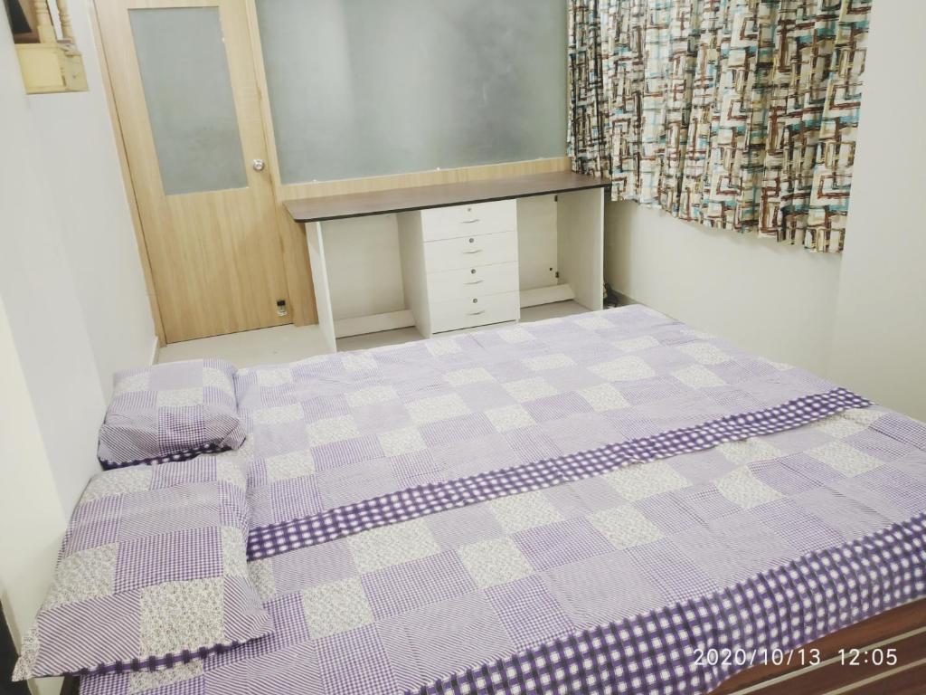 A bed or beds in a room at Aaramgruh Hotel Dormitory