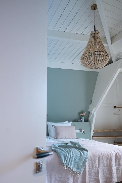 Postel nebo postele na pokoji v ubytování Boutique Hotel - de Stadsherberg Alphen