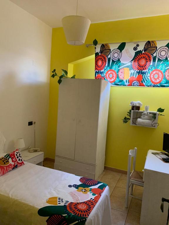 Posteľ alebo postele v izbe v ubytovaní Paradiso della Zagara