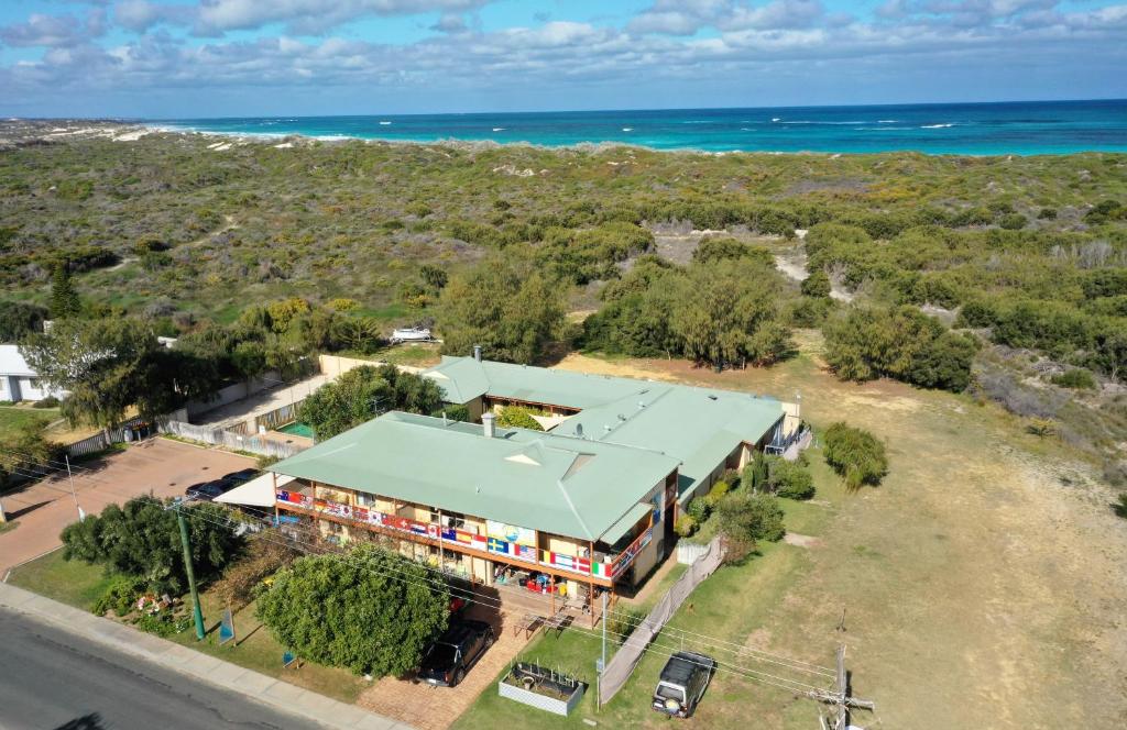 an aerial view of a building with the ocean in the background at Lancelin Lodge in Lancelin
