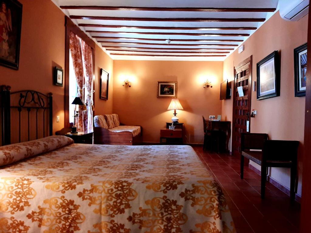 Postel nebo postele na pokoji v ubytování Hotel Rural Posada Los Caballeros