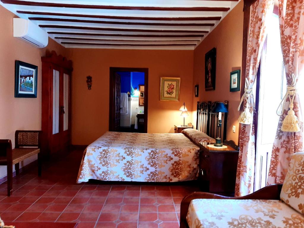 Postel nebo postele na pokoji v ubytování Hotel Rural Posada Los Caballeros