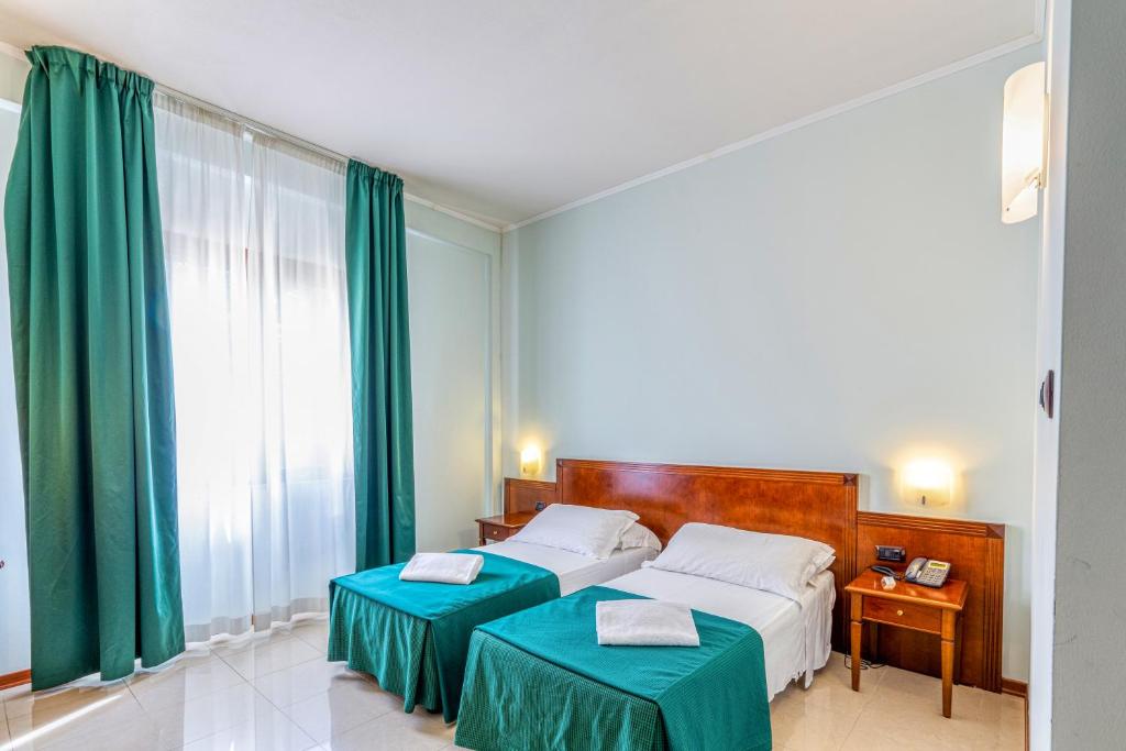 Posteľ alebo postele v izbe v ubytovaní Hotel Le Torri