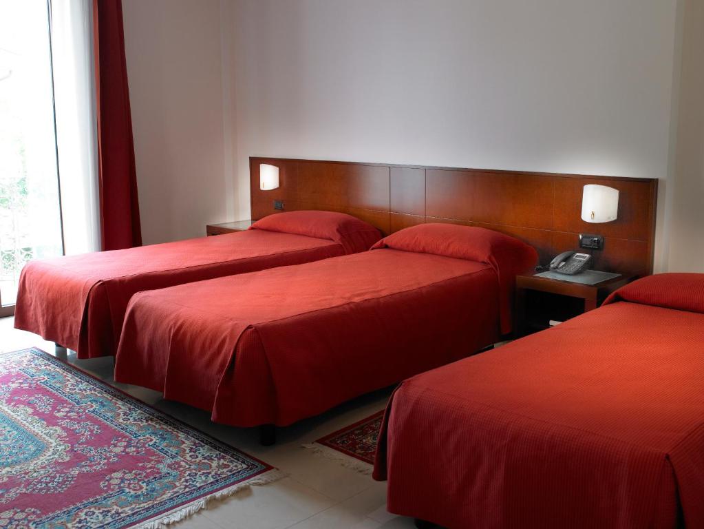 Posteľ alebo postele v izbe v ubytovaní Hotel Le Torri