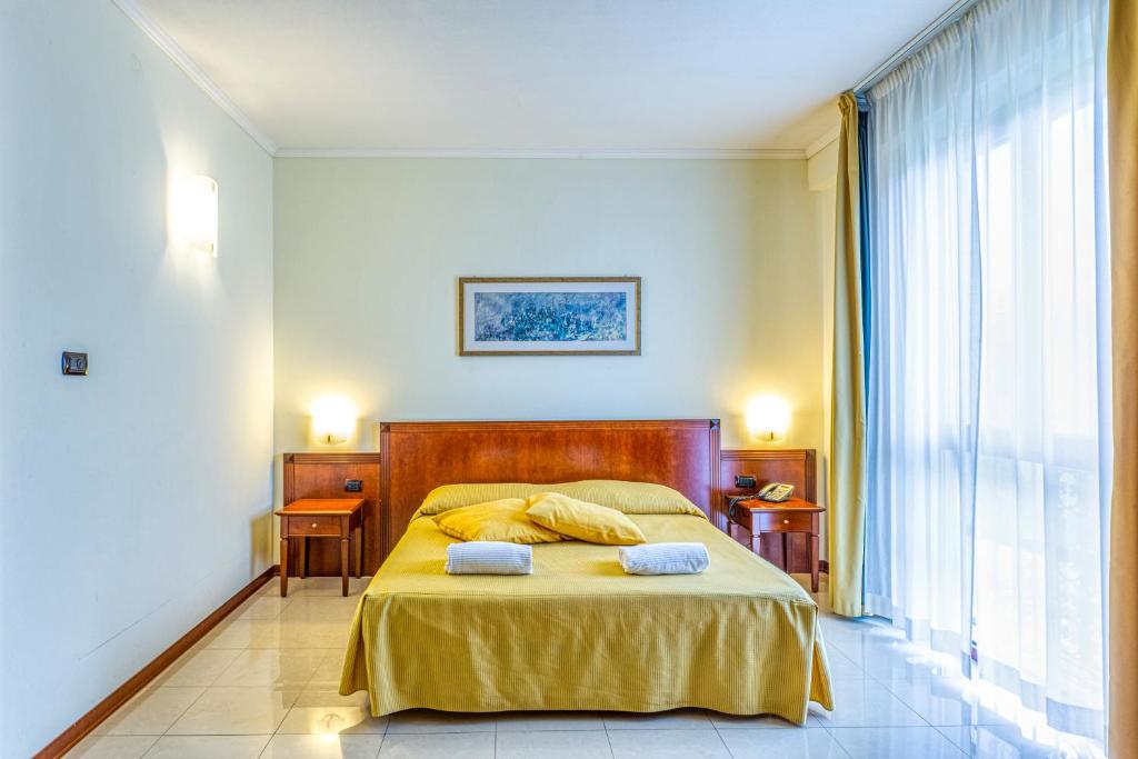 Posteľ alebo postele v izbe v ubytovaní Hotel Le Torri