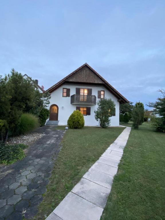 a house with a walkway in front of it at Landhaus in Pförring in Pförring