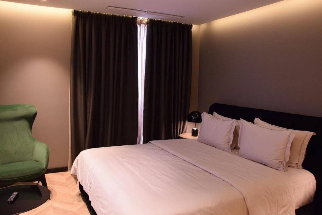 Postel nebo postele na pokoji v ubytování Hotel Unik
