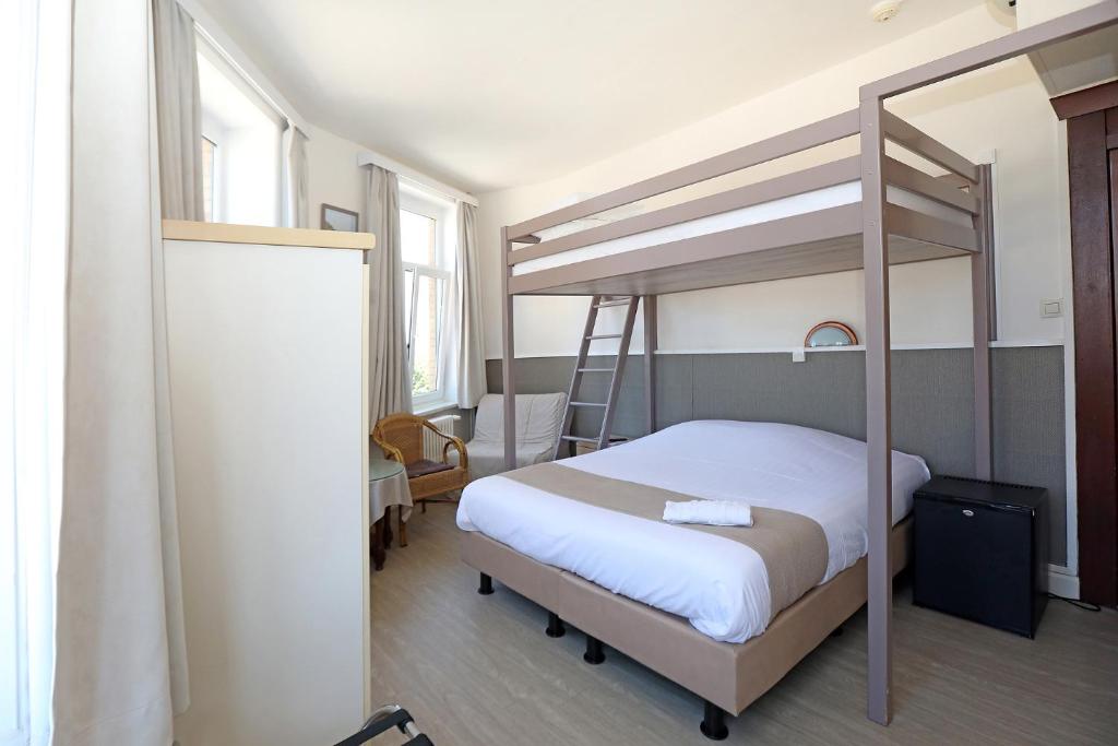 Cama o camas de una habitación en Hotel Cecil