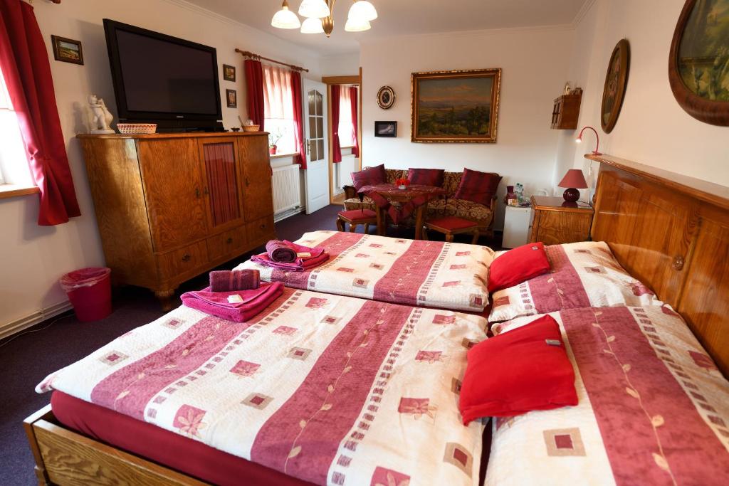 Postel nebo postele na pokoji v ubytování Penzion v chaloupce