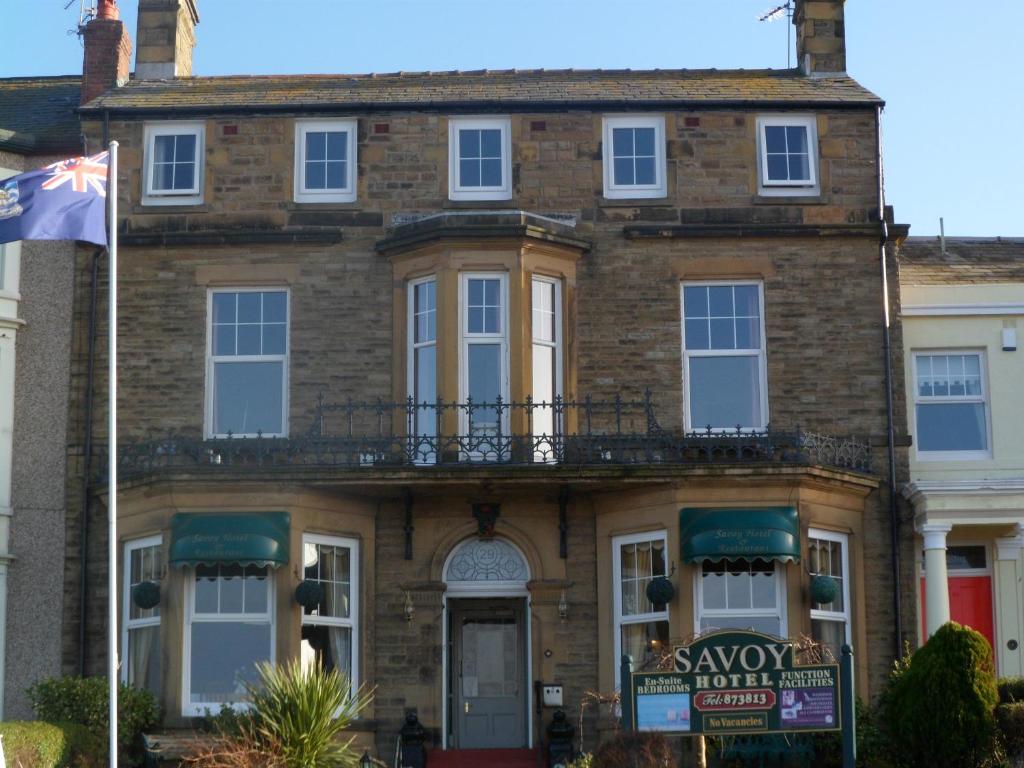 a house with a flag in front of it at Savoy in Fleetwood