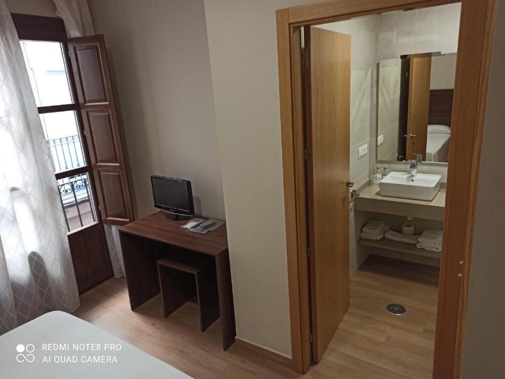 Telewizja i/lub zestaw kina domowego w obiekcie Hosteria de Rafi