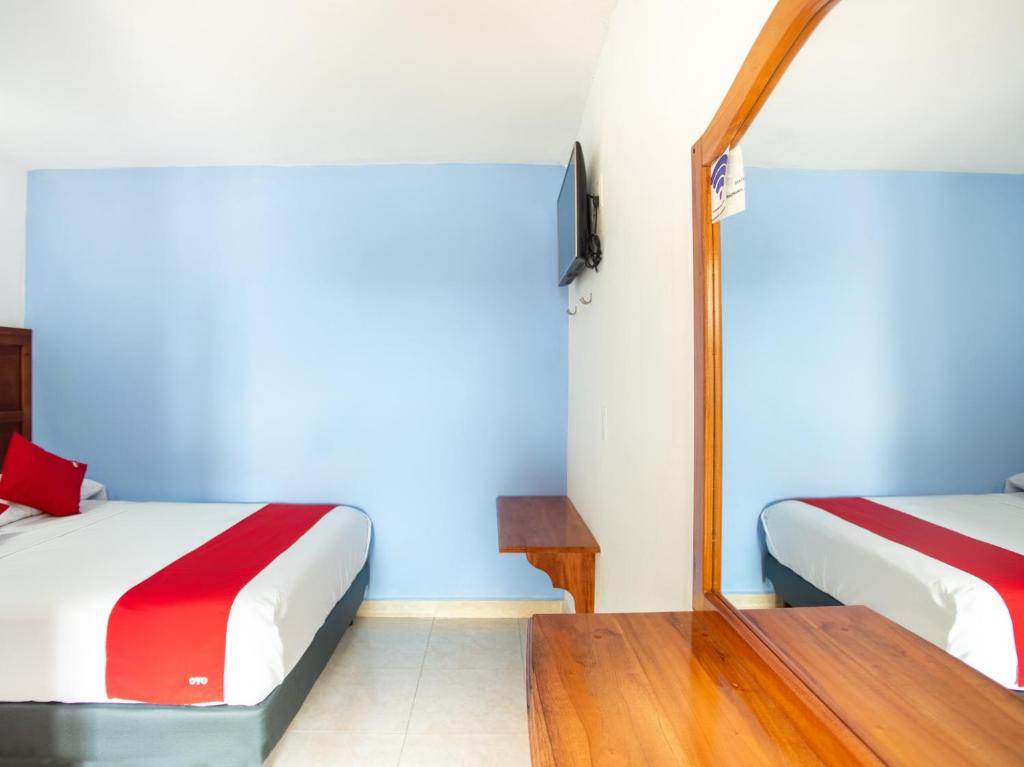 Postel nebo postele na pokoji v ubytování Hotel Casa Poblana