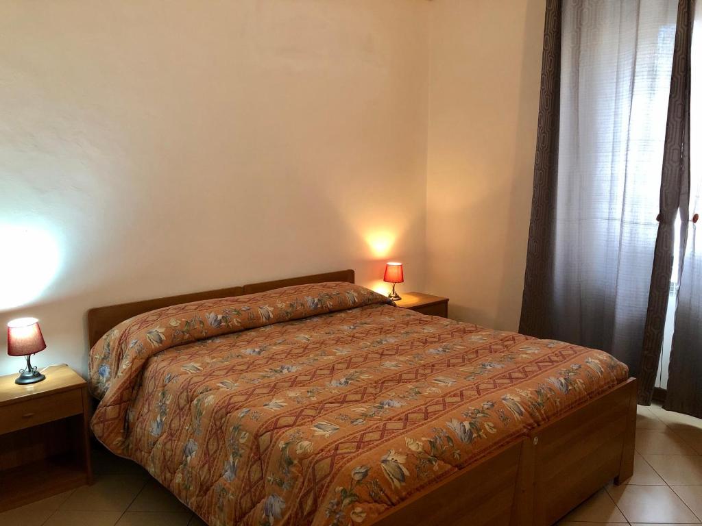Posteľ alebo postele v izbe v ubytovaní Residenza Pitigliano Gens Petilia - Nuova gestione