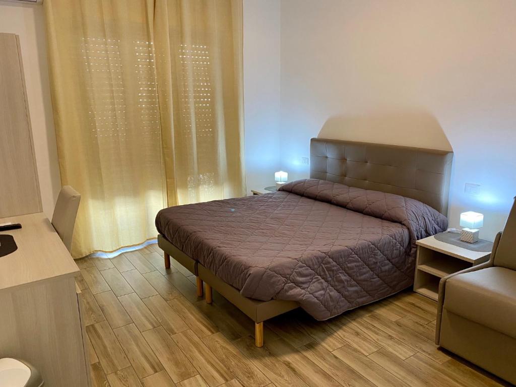 Postel nebo postele na pokoji v ubytování Caruso Rooms