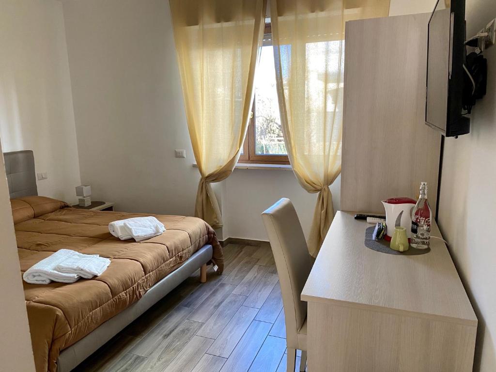 Postel nebo postele na pokoji v ubytování Caruso Rooms