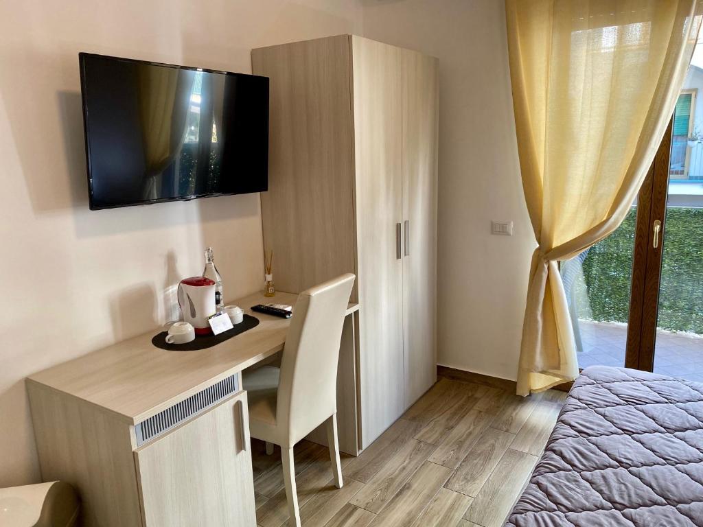 TV a/nebo společenská místnost v ubytování Caruso Rooms