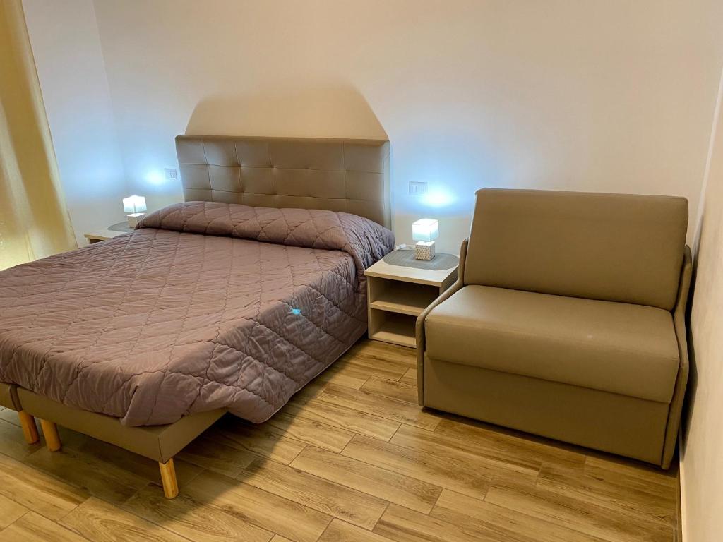 Postel nebo postele na pokoji v ubytování Caruso Rooms