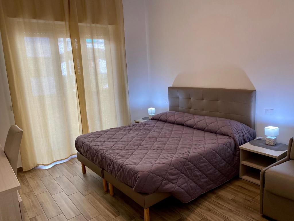 Postel nebo postele na pokoji v ubytování Caruso Rooms