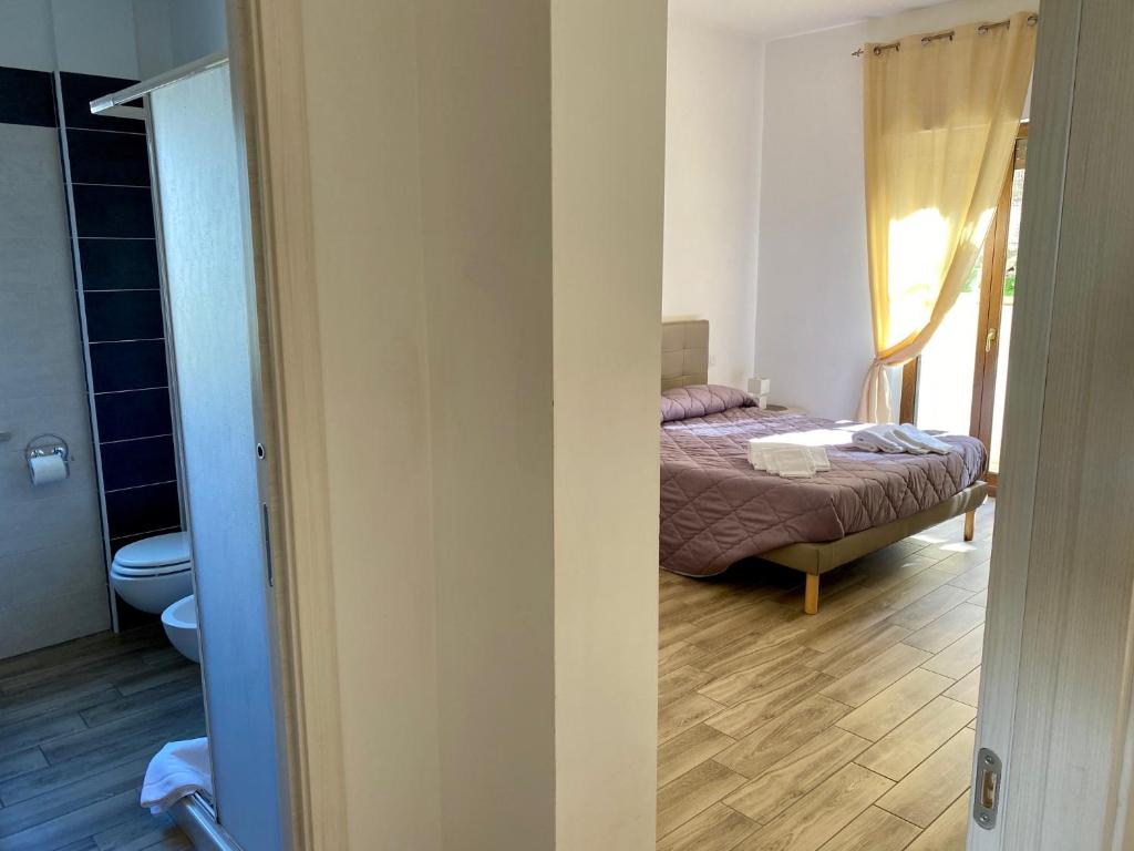 Postel nebo postele na pokoji v ubytování Caruso Rooms