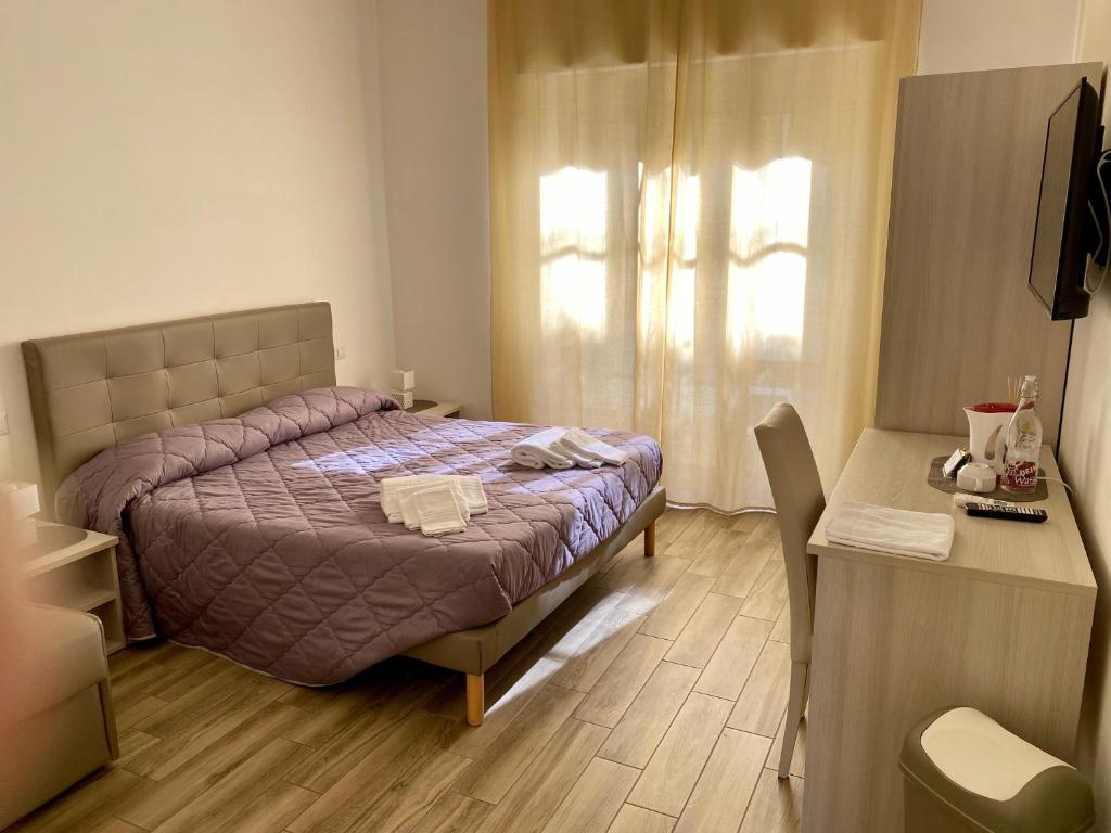 Postel nebo postele na pokoji v ubytování Caruso Rooms