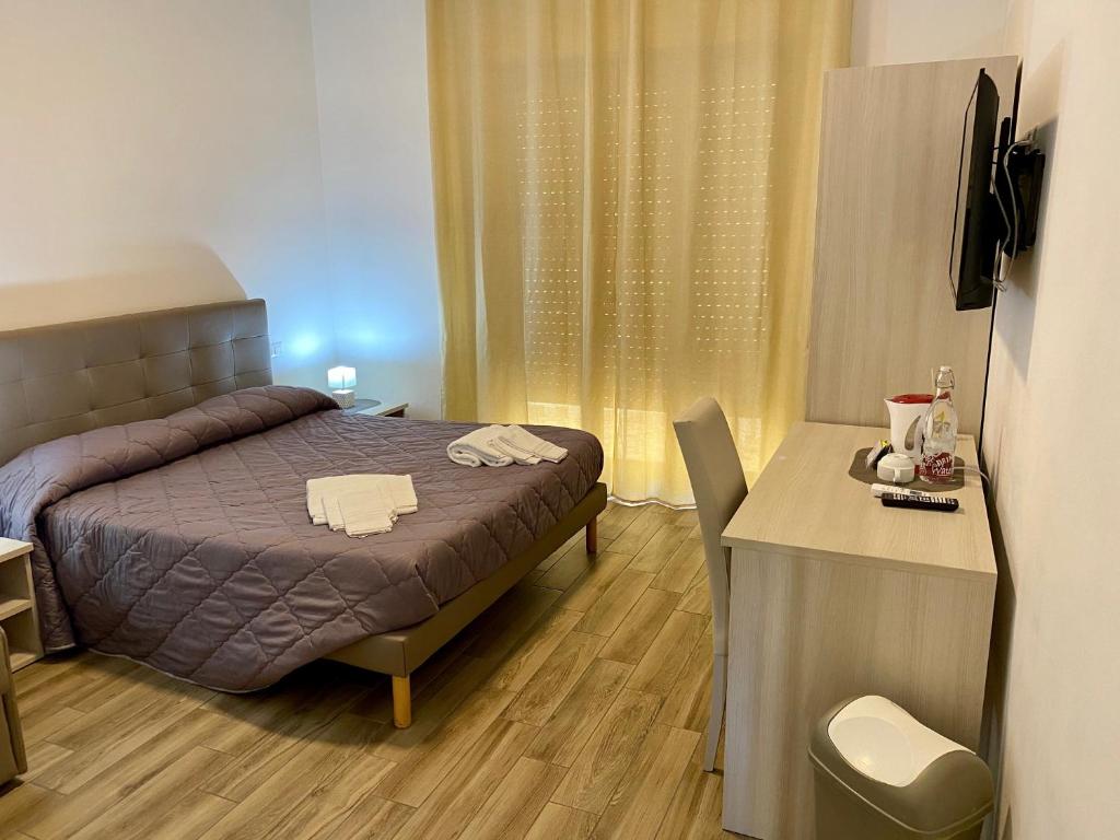 Postel nebo postele na pokoji v ubytování Caruso Rooms