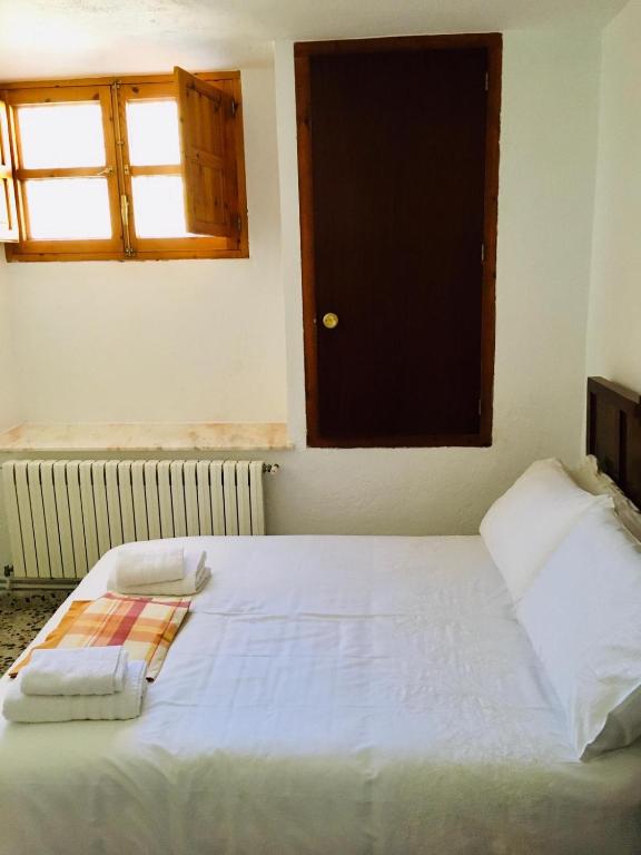 A bed or beds in a room at CORTIJO VIANA LA SAGRA