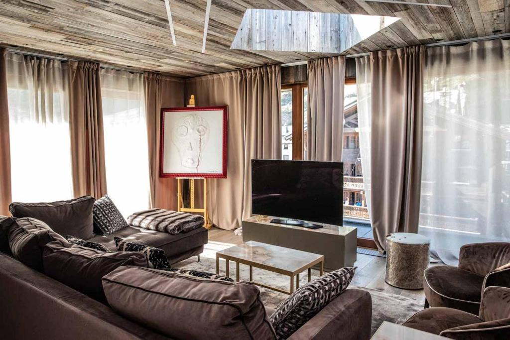TV a/nebo společenská místnost v ubytování Art Hotel Grivola