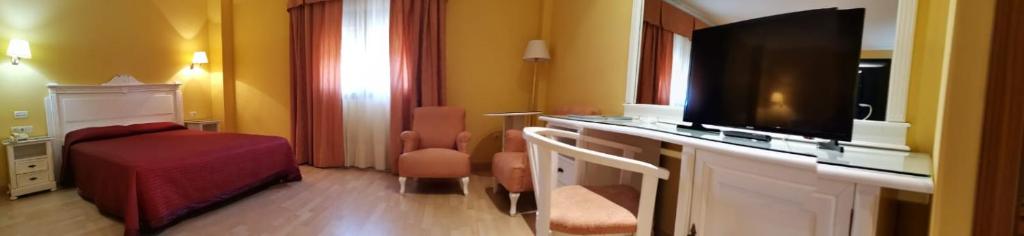 Posteľ alebo postele v izbe v ubytovaní Hotel Acosta Vetonia