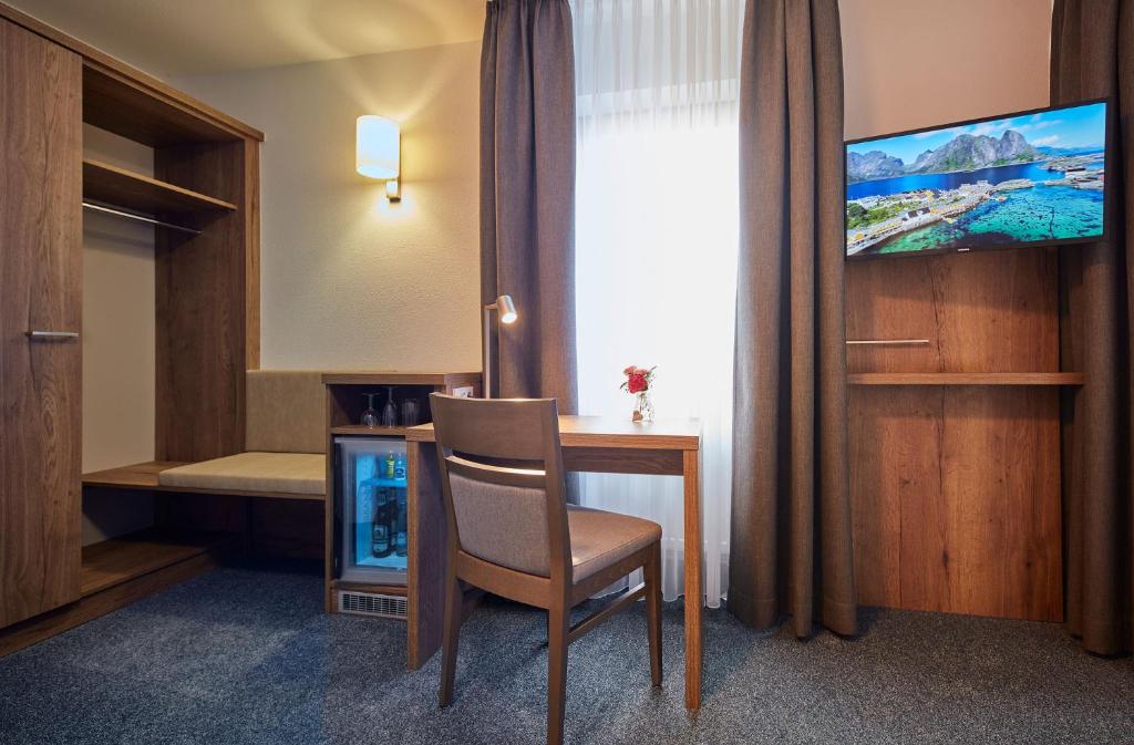 TV a/nebo společenská místnost v ubytování Hotel garni Sonnenhof