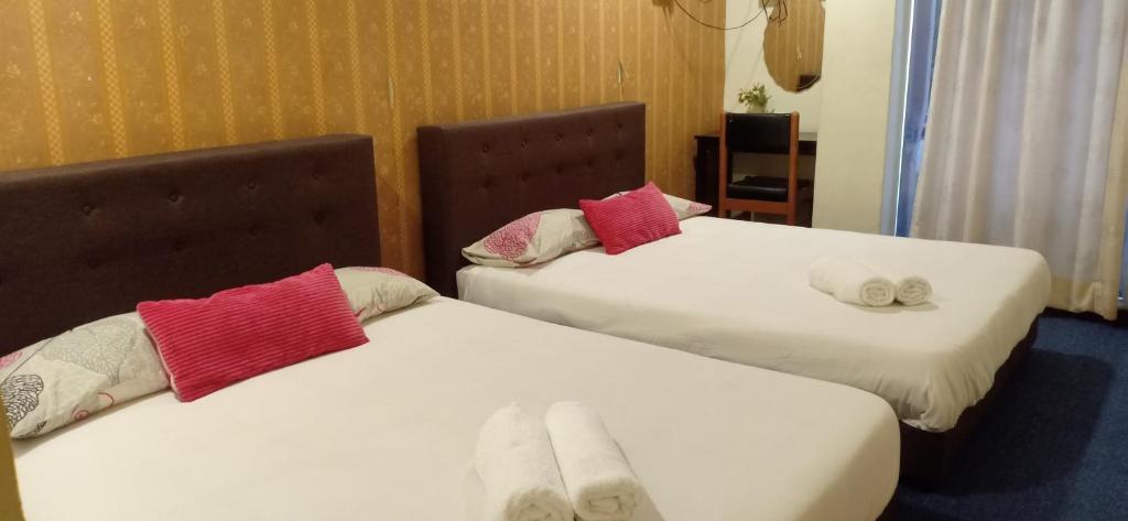 Postel nebo postele na pokoji v ubytování Hotel Tropicanna Pulai Point