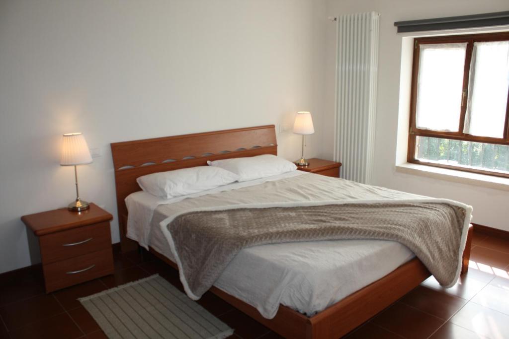 Ein Bett oder Betten in einem Zimmer der Unterkunft VILLA COLLE