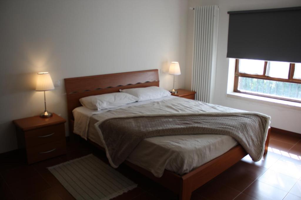 Ein Bett oder Betten in einem Zimmer der Unterkunft VILLA COLLE