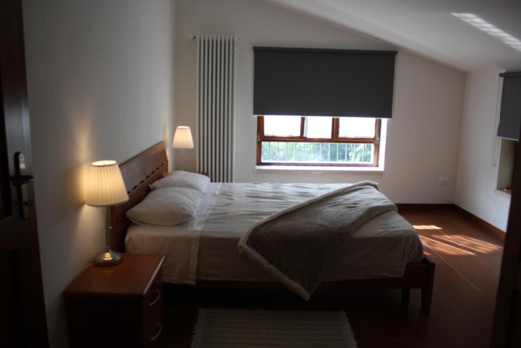 Ein Bett oder Betten in einem Zimmer der Unterkunft VILLA COLLE