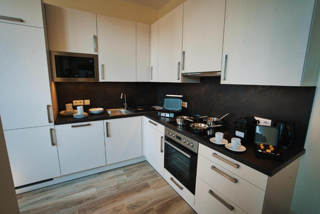 Kuchyňa alebo kuchynka v ubytovaní M-24 Apartments